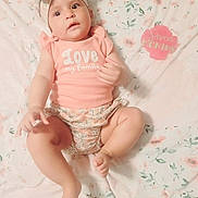 Josslyn joined the competition — help win amazing prizes! baby, infant, child, headband, floral, blanket, milestone_card, seven_months, clothing, cute, portrait, lying_down, soft_lighting, family, pink, patterned, smiling, skin, hands, feet