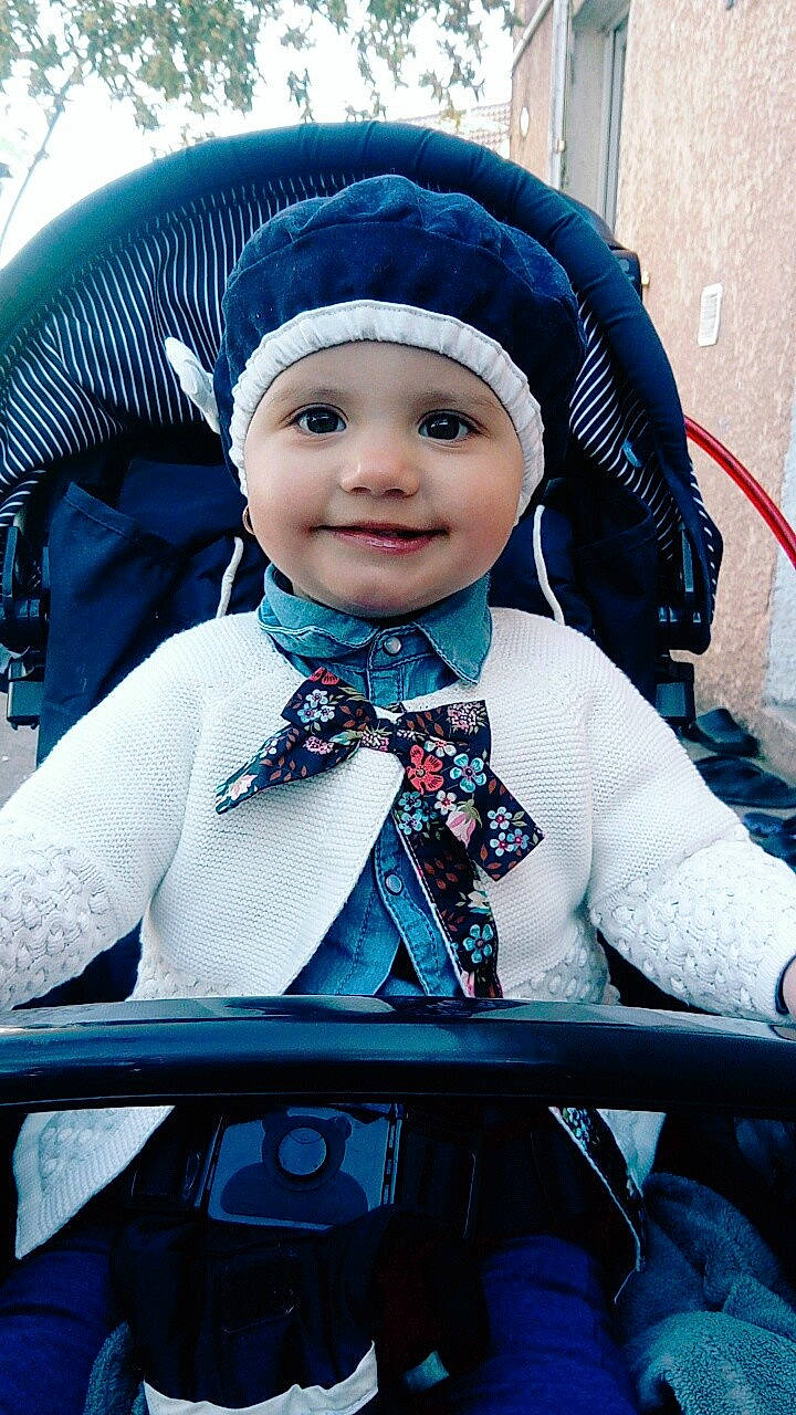 Andra participe au concours pour gagner de l'argent avec cette photo : blue, child, cool, eye, fun, girl, headgear, headwear, human, infant, joy, person, product, skin, smile, toddler, winter