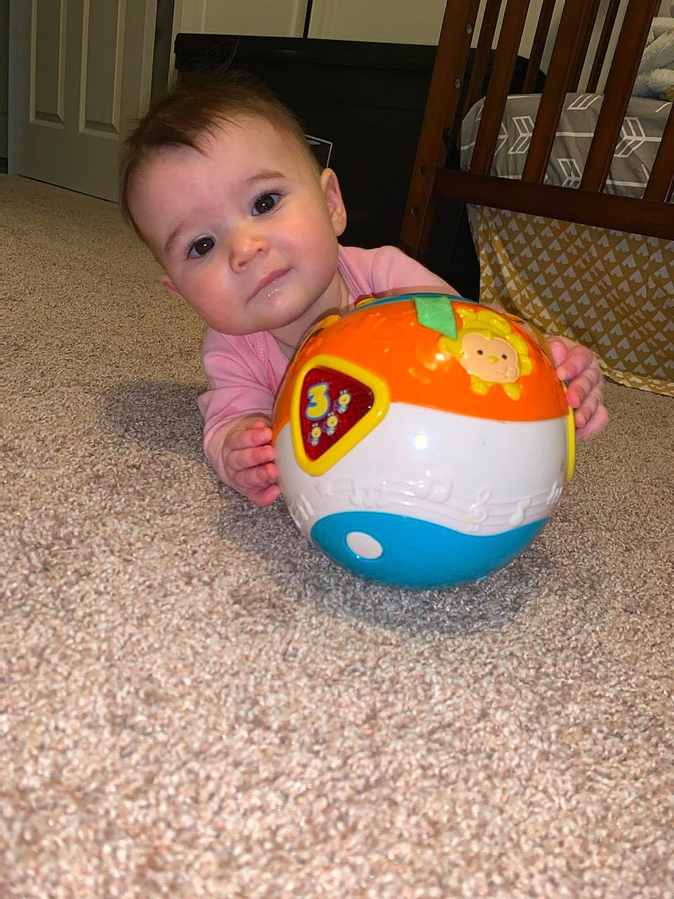 Emmie joined the competition — help win amazing prizes! baby, baby_playing_with_toys, baby_toys, ball, child, floor, flooring, fun, person, play, soccer_ball, toddler, toy