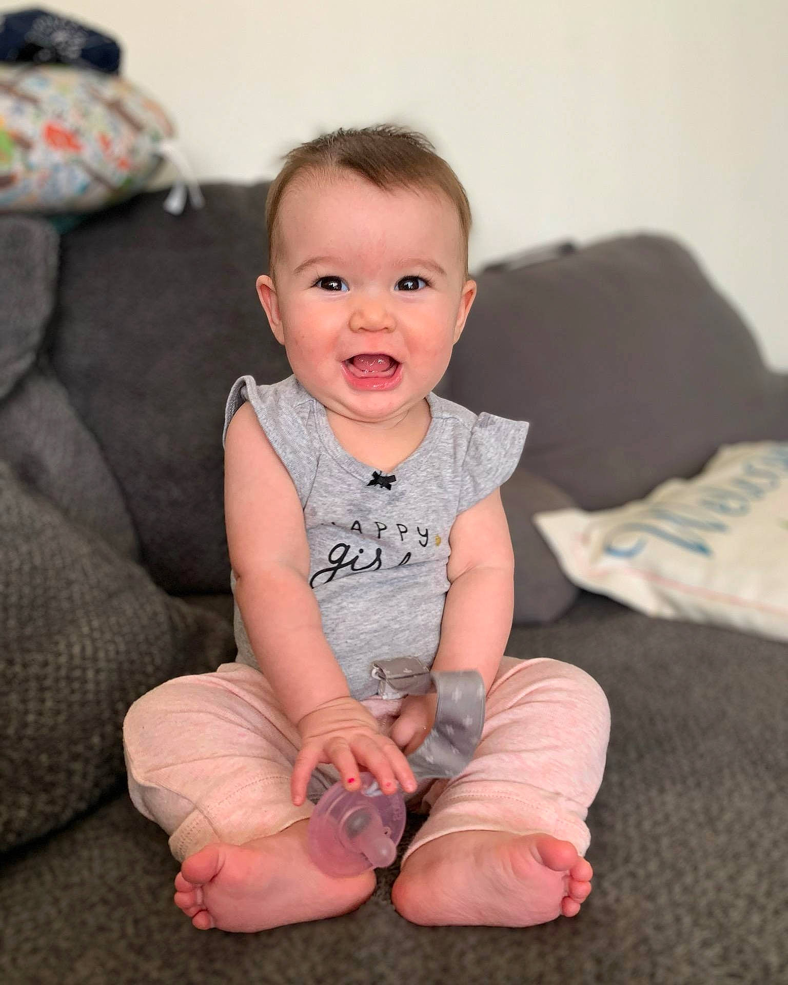 Emmie joined the competition — help win amazing prizes! arm, baby, baby_toddler_clothing, barefoot, cheek, child, eye, face, finger, foot, head, human, knee, leg, person, pink, sitting, skin, smile, sole