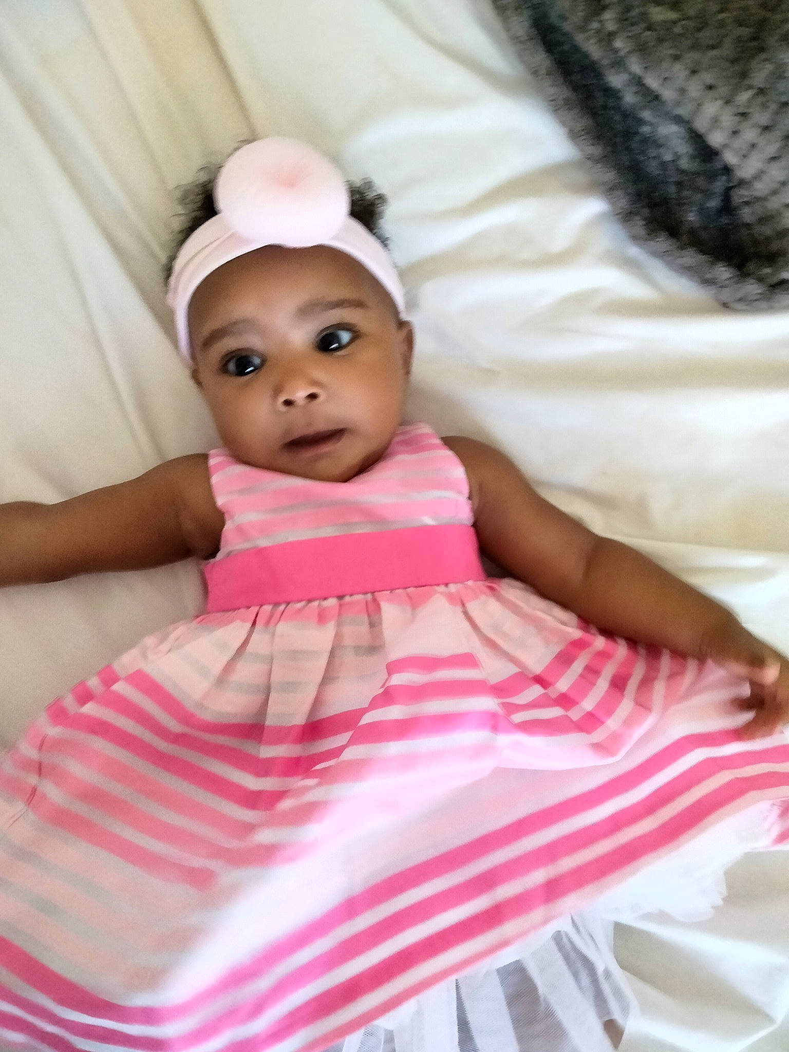 A'Blessyng is registered to the contest to win money with this photo: baby, baby_toddler_clothing, child, comfort, doll, dress, eyelash, fashion_accessory, happy, headpiece, linens, magenta, pattern, peach, person, pink, ruffle, sleeve, textile, toddler