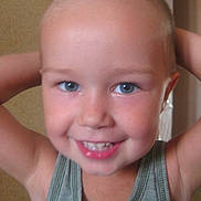 Michael is registered to the contest to win money with this photo: child, smiling, blue_eyes, tank_top, indoor, portrait, happy, cute, face, skin, short_hair, young, person, childhood, closeup, expression, casual, human, photography, background