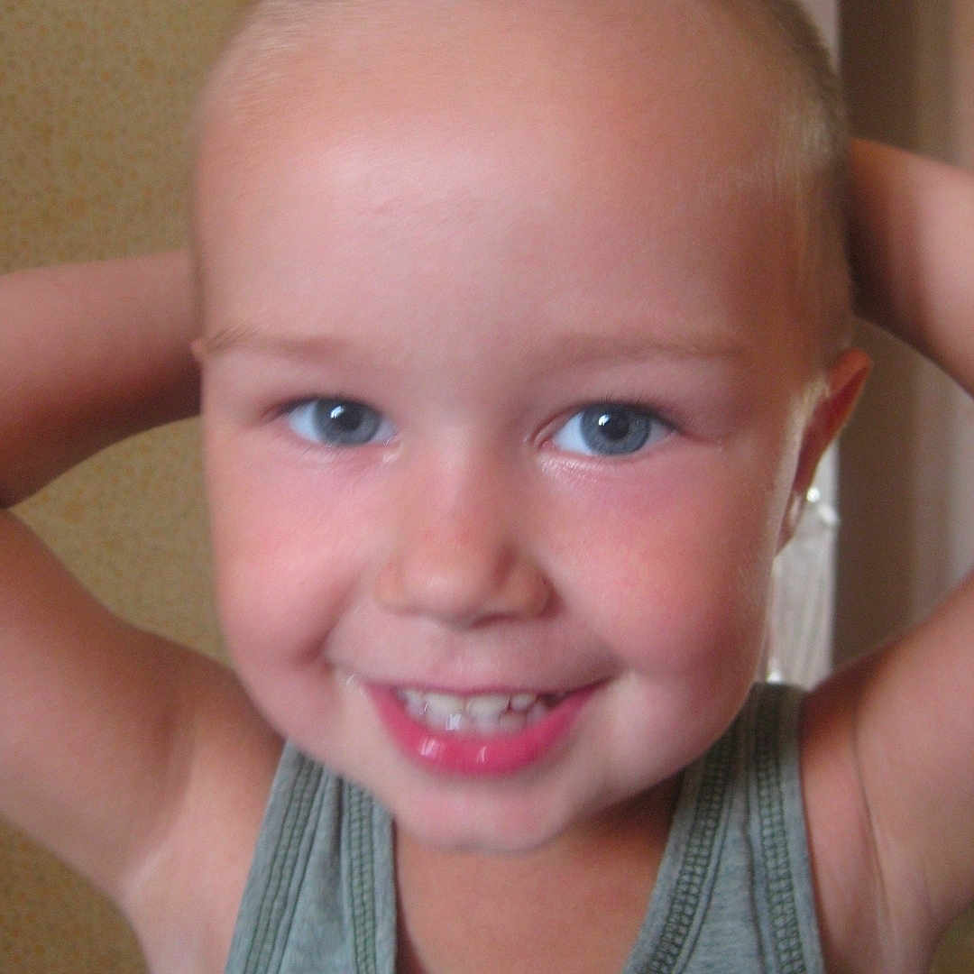 Michael is registered to the contest to win money with this photo: child, smiling, blue_eyes, tank_top, indoor, portrait, happy, cute, face, skin, short_hair, young, person, childhood, closeup, expression, casual, human, photography, background
