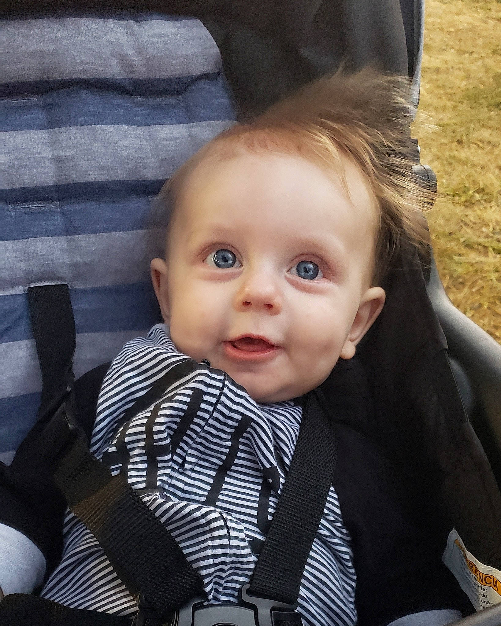 Marvin is registered to the contest to win money with this photo: baby, baby_carriage, baby_products, cheek, child, electronic_device, eye, face, hairstyle, head, iris, lip, male, nose, people, person, product, sitting, skin, smile