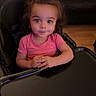 toddler, child, baby, portrait, sitting, high_chair, pink_shirt, brown_hair, blue_eyes, wide_eyed, smiling, indoors, home, living_room, couch, pillow, wood_floor, tray, furniture, photography
