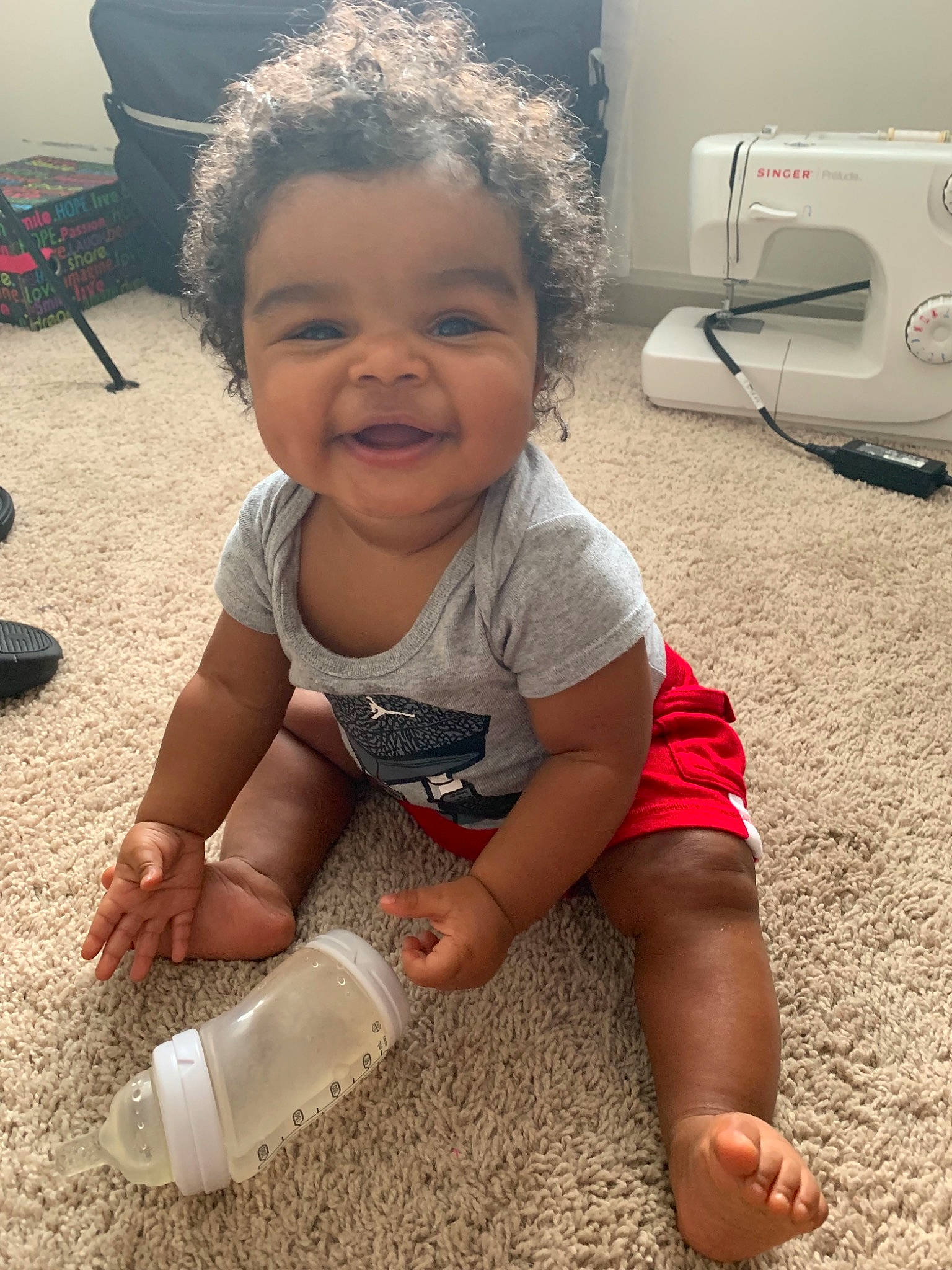 Juelz is registered to the contest to win money with this photo: baby, baby_products, child, fun, head, leg, person, play, product, sitting, skin, smile, toddler, water