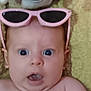 Loralie is registered to the contest to win money with this photo: baby, face, sunglasses, pink, expression, surprised, blue_eyes, blanket, closeup, skin, child, portrait, infant, mouth_open, head, eyewear, cute, lying_down, indoors, soft