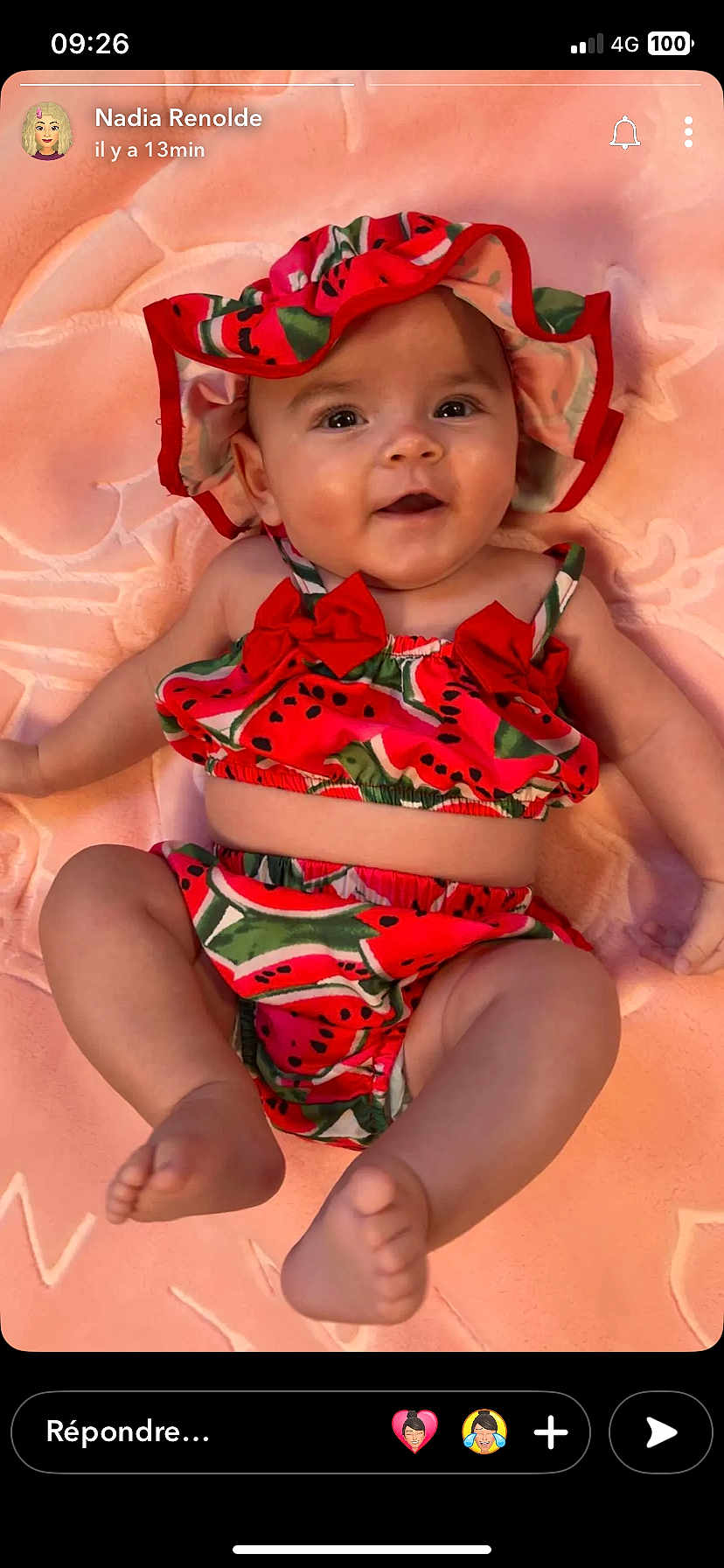 Joy participe au concours pour gagner de l'argent avec cette photo : baby, infant, smiling, watermelon_outfit, hat, pink_blanket, cute, happy, child, lying_down, summer_clothes, chubby_legs, adorable, playful, person, portrait, closeup, skin, face, headwear