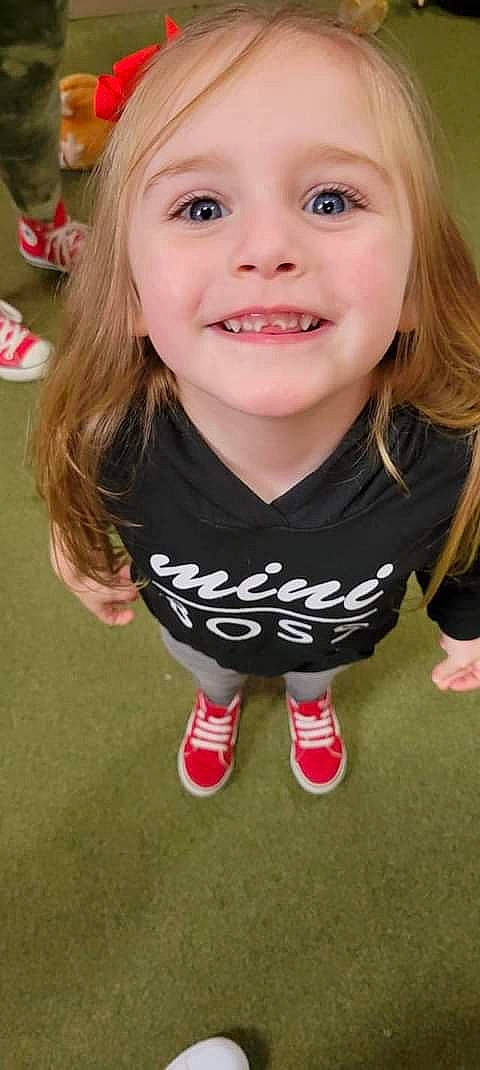 Danielle joined the competition — help win amazing prizes! baby_toddler_clothing, blond, cheek, eye, eyelash, face, fun, grass, hair, happy, head, joy, lip, person, pink, shorts, skin, sleeve, smile, standing