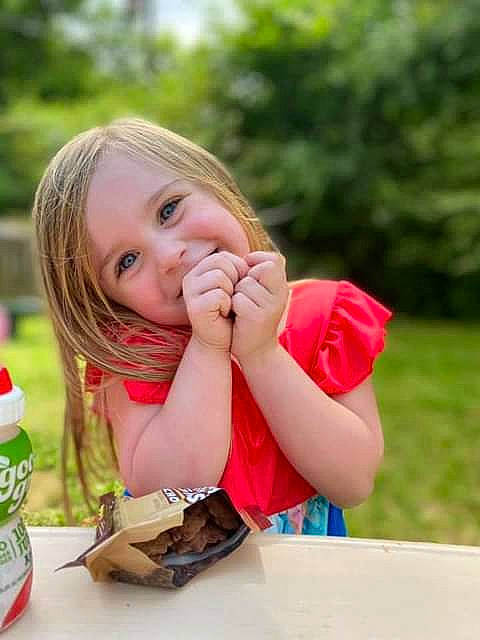 Danielle joined the competition — help win amazing prizes! child, eating, finger, food_craving, fun, gesture, grass, happy, joy, leisure, nail, people_in_nature, person, plastic_bottle, play, recreation, sitting, skin, sweetness, table