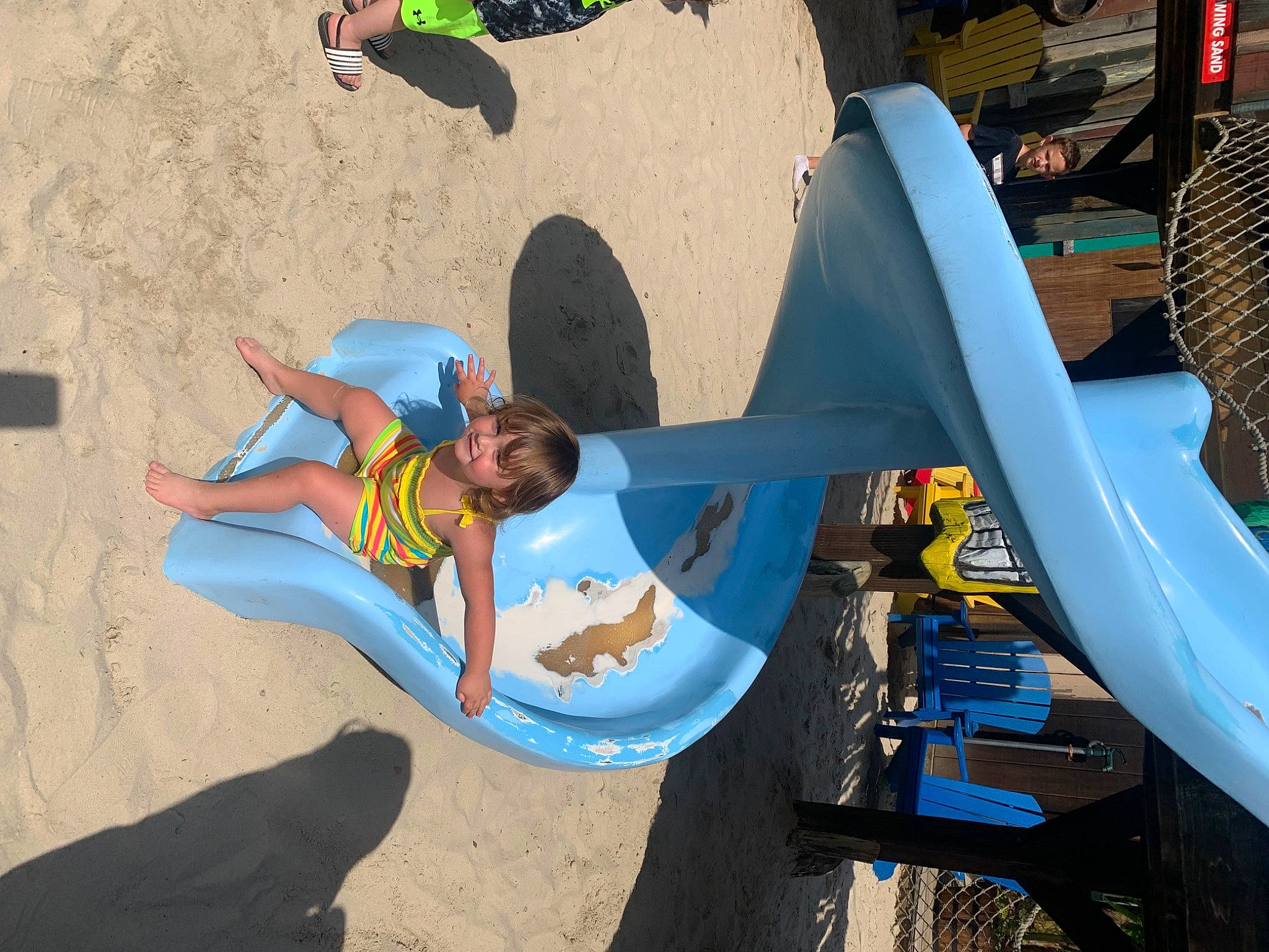 Everleigh is registered to the contest to win money with this photo: art, automotive_exterior, beach, bumper, chute, city, fun, hat, joy, landscape, leisure, machine, outdoor_play_equipment, person, pipe, plastic, play, playground_slide, recreation, shorts