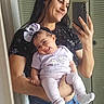 baby, bow, casual, child, clothing, door, floor, happy, headband, holding, indoor, jeans, mirror, person, portrait, reflection, selfie, smile, tshirt, woman