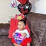 Niema is registered to the contest to win money with this photo: toddler, child, couch, balloons, valentines_day, heart_shaped, chocolate_box, red_skirt, smiling, indoor, happy, celebration, gift, holiday, person, cute, sitting, decor, love, party