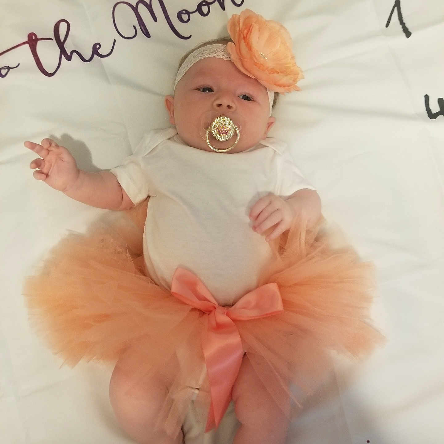 Isabella is registered to the contest to win money with this photo: accessories, baby, bed, bodypart, clothing, crib, cushion, dress, face, finger, furniture, hand, head, homedecor, infantbed, jewelry, newborn, person, photography, portrait