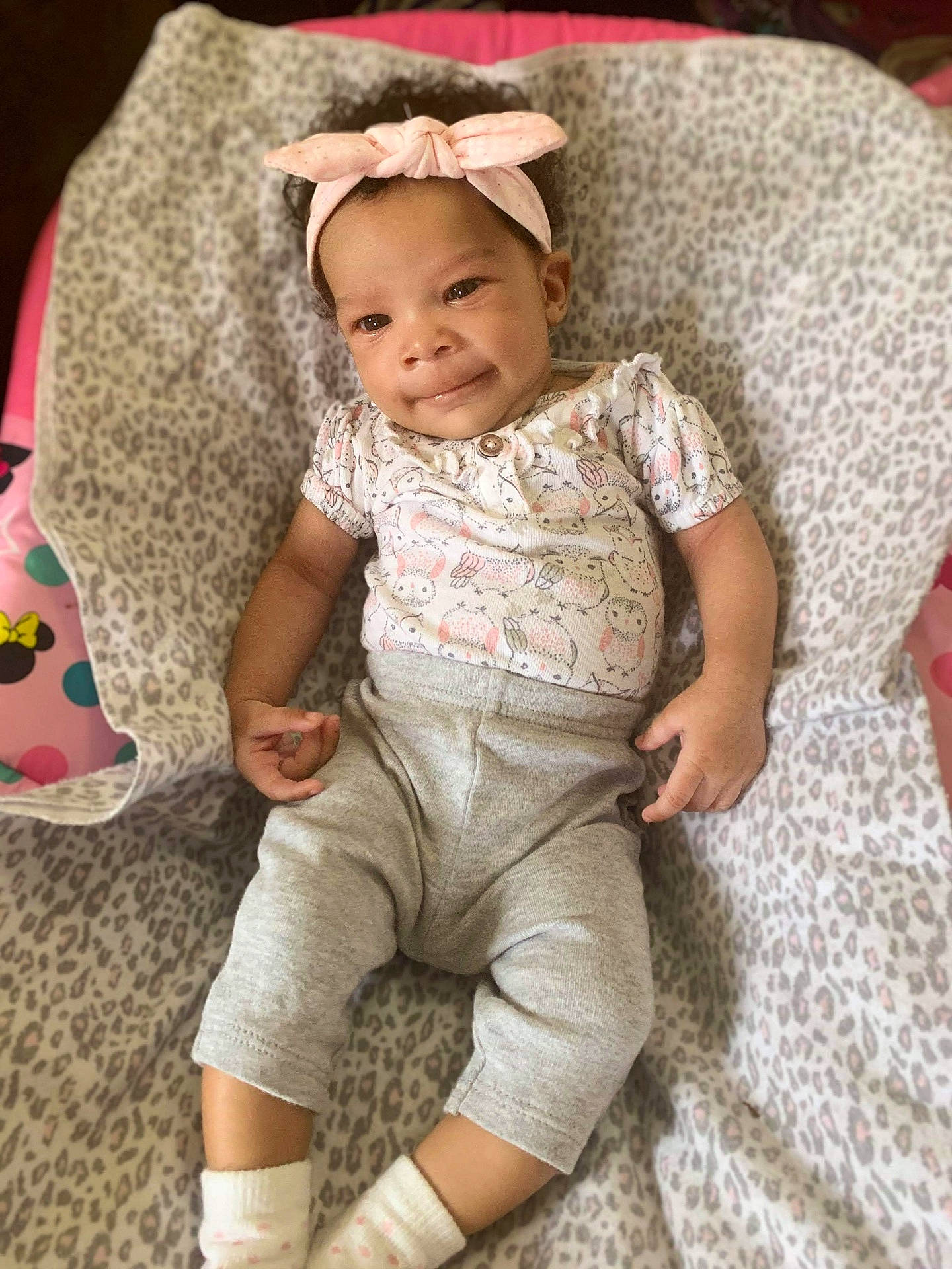 A'Niyah is registered to the contest to win money with this photo: baby, baby_products, baby_toddler_clothing, bonnet, hair_accessory, headband, human, joy, linens, nightwear, nose, person, pink, sock, toddler