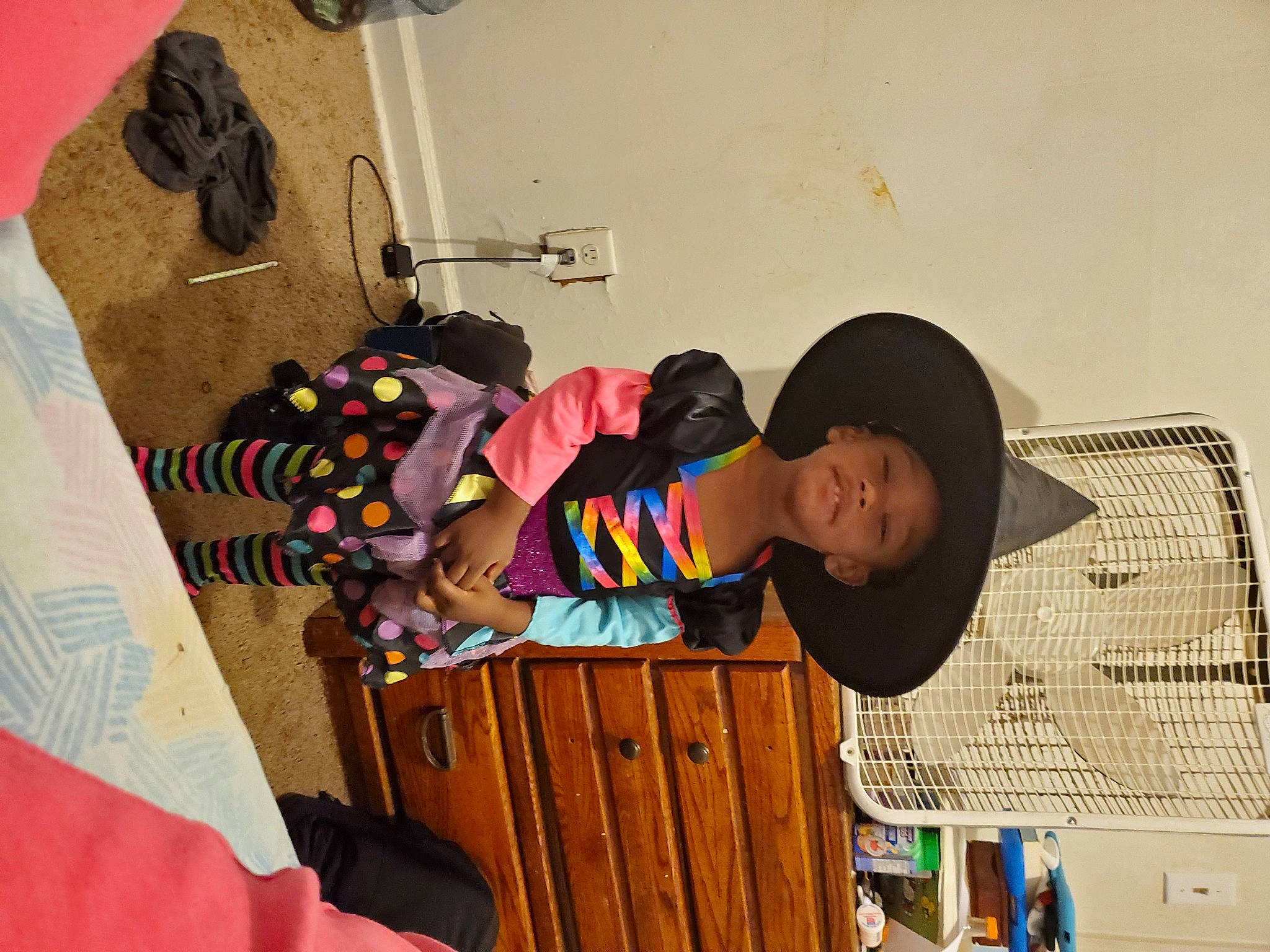 Jodi is registered to the contest to win money with this photo: baby_toddler_clothing, cabinetry, chest_of_drawers, drawer, headwear, linens, person