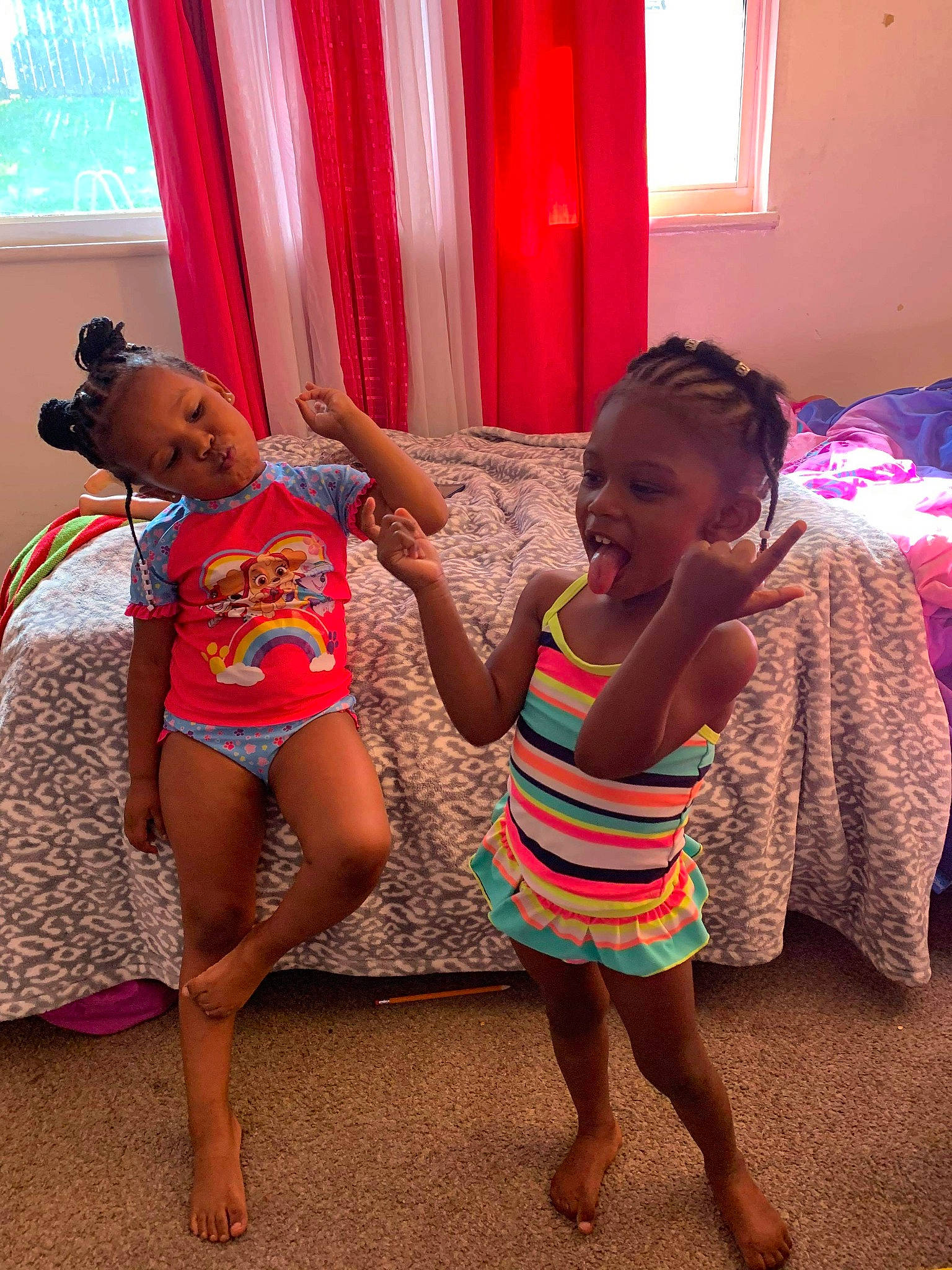 Jodi is registered to the contest to win money with this photo: baby_toddler_clothing, barefoot, child, curtain, ear, finger, foot, fun, hand, human_body, interior_design, linens, magenta, person, pink, skin, textile, toddler, toe, trunk