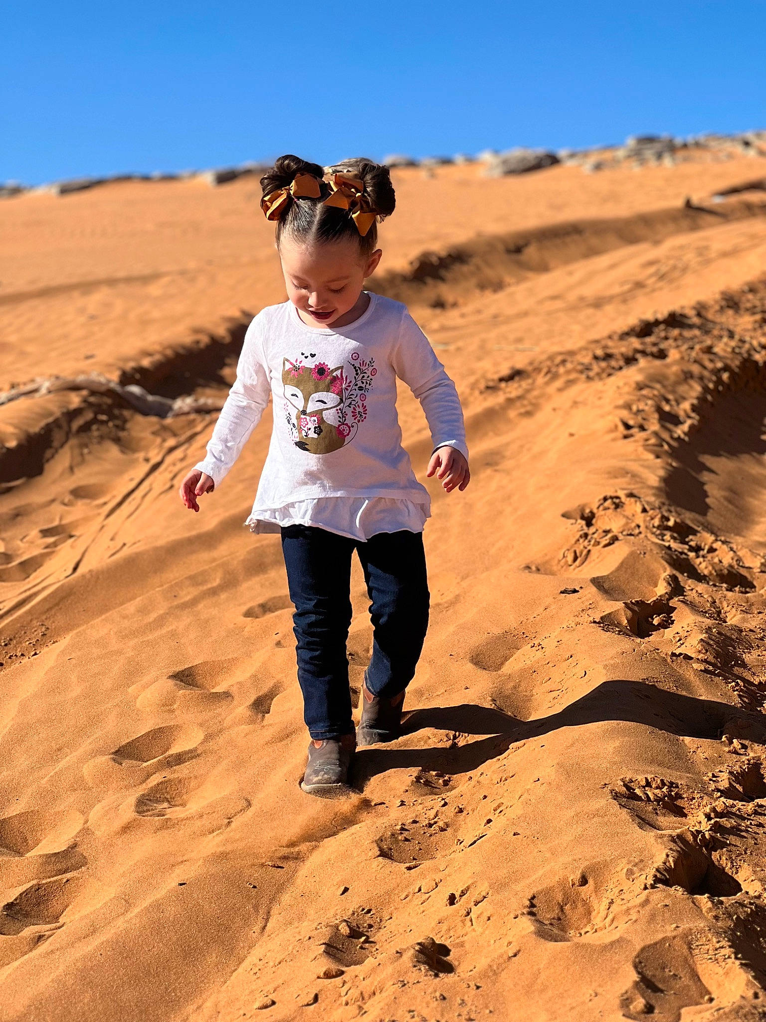 Addilyn joined the competition — help win amazing prizes! aeolian_landform, body_of_water, dune, erg, fun, happy, hill, horizon, landscape, leisure, people_in_nature, person, recreation, sand, shadow, singing_sand, sky, soil, sunglasses, toddler