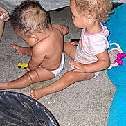 Karma joined the competition — help win amazing prizes! children, siblings, toddler, baby, sitting, carpet, toy_car, toy, playtime, indoors, curly_hair, diaper, pink_shirt, barefoot, family, play_area, blue_mat, infant, portrait, candid