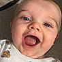 baby, child, face, smiling, happy, cute, infant, closeup, mouth_open, blue_eyes, clothing, pattern, animal_print, lion_cub, skin, eyelashes, tongue, head, indoors, portrait