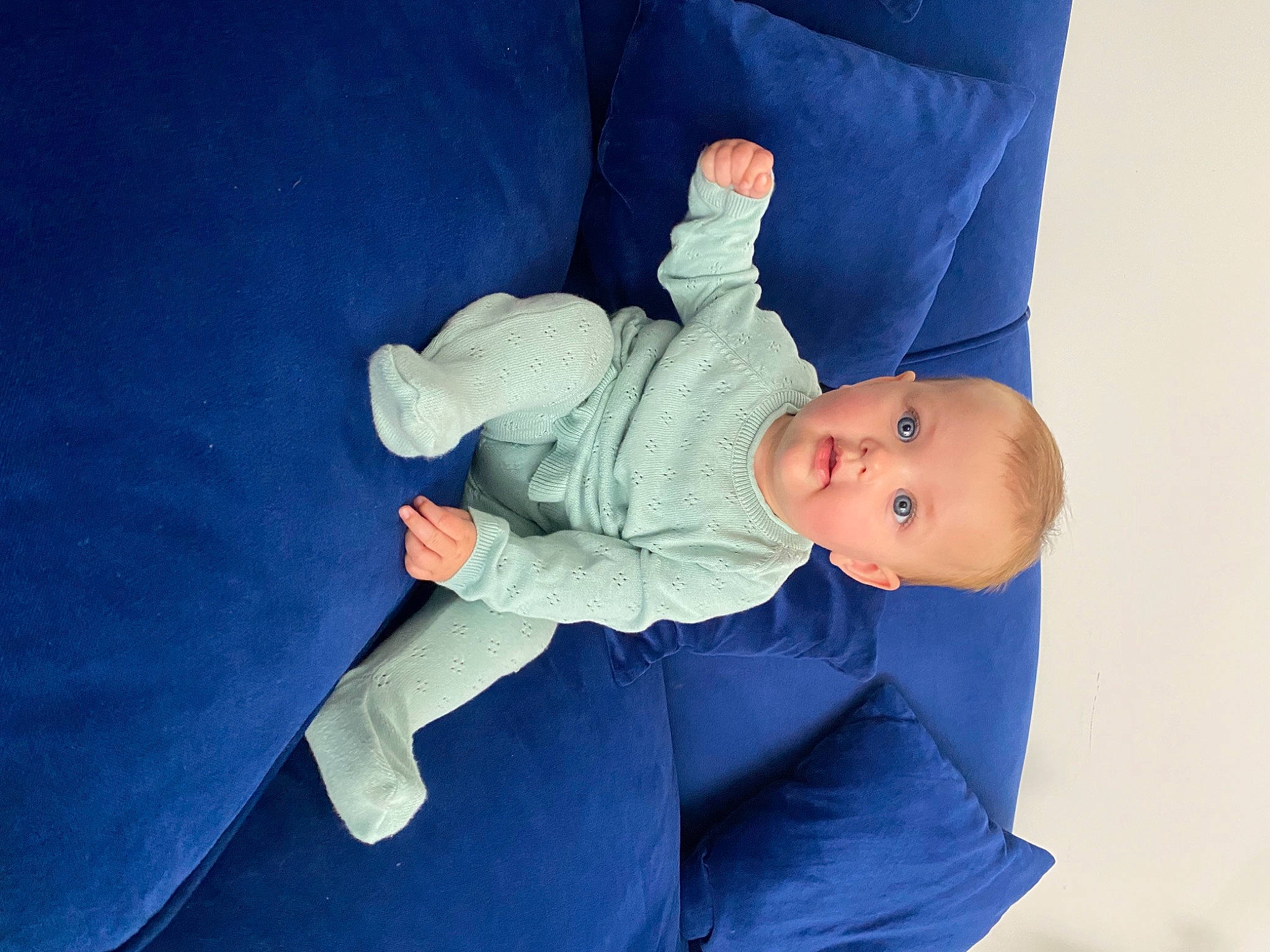 Olive Reign is registered to the contest to win money with this photo: azure, baby, baby_products, baby_sleeping, baby_toddler_clothing, child, comfort, elbow, electric_blue, finger, human_leg, knee, leg, person, room, sitting, sleeve, toddler
