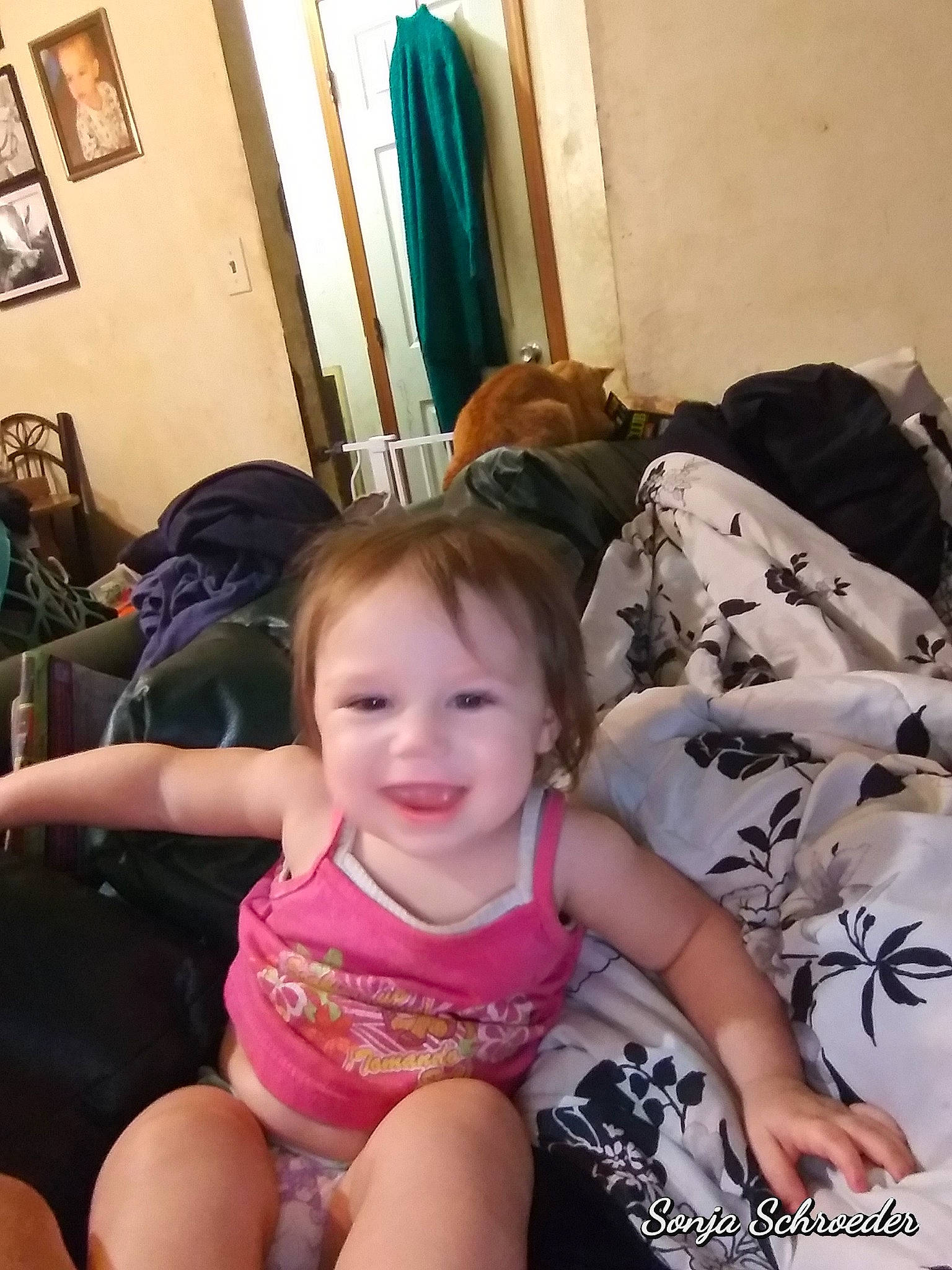 Dixie is registered to the contest to win money with this photo: cheek, child, ear, finger, happy, joy, leg, person, sitting, smile, thumb, toddler