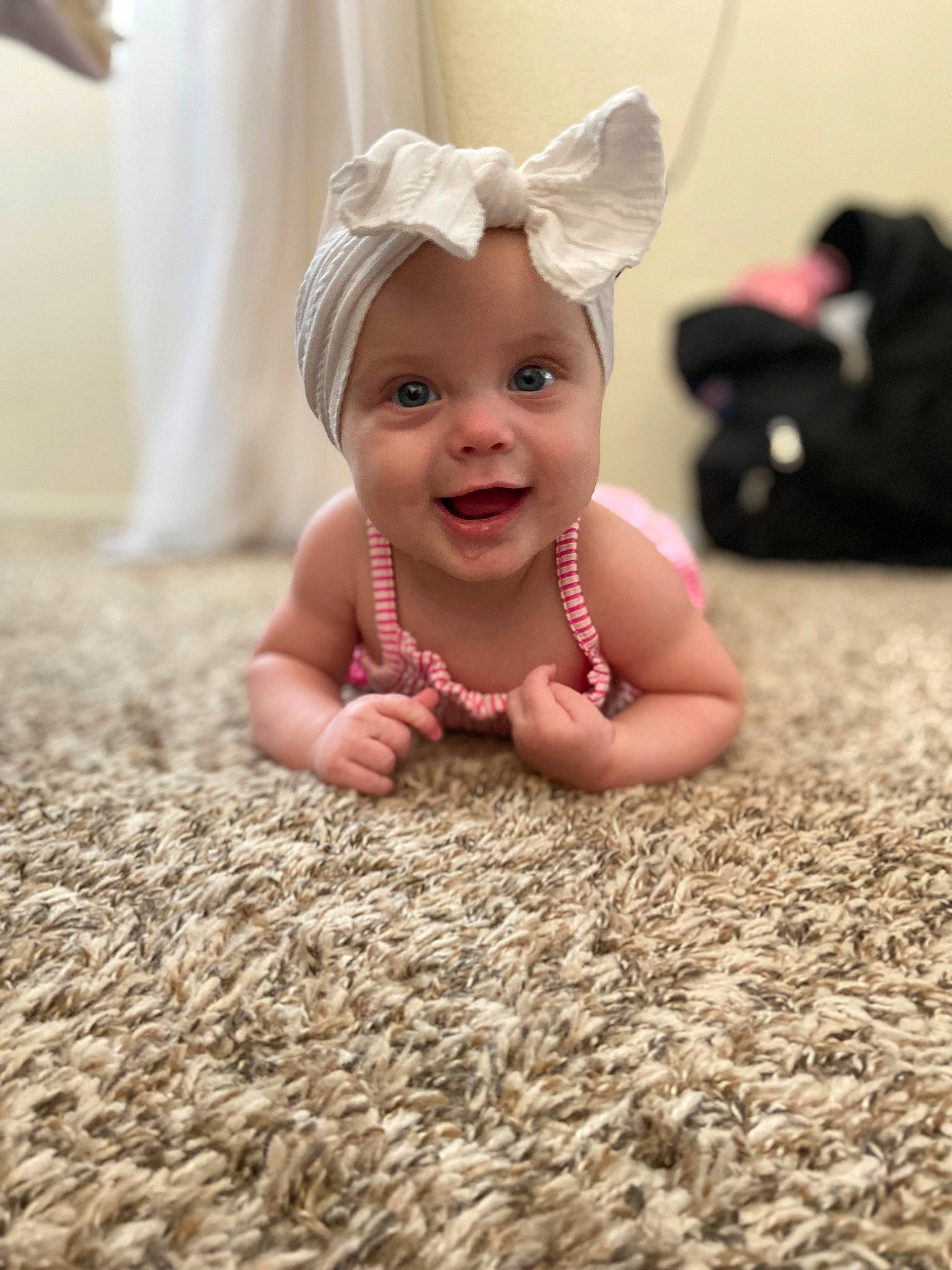 Aubrey is registered to the contest to win money with this photo: baby, baby_toddler_clothing, child, chin, eye, face, flash_photography, floor, flooring, fun, grass, happy, head, iris, people_in_nature, person, sitting, skin, sleeve, smile