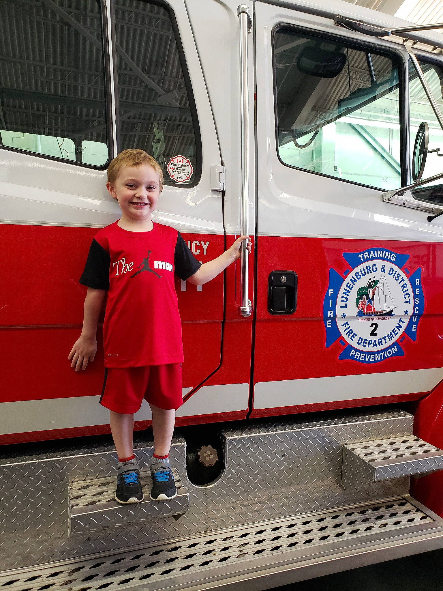 Jaxxson joined the competition — help win amazing prizes! car, child, commercial_vehicle, door, emergency_service, emergency_vehicle, fire_apparatus, fire_department, joy, leisure, mode_of_transport, person, recreation, red, standing, toddler, transport, vacation, vehicle