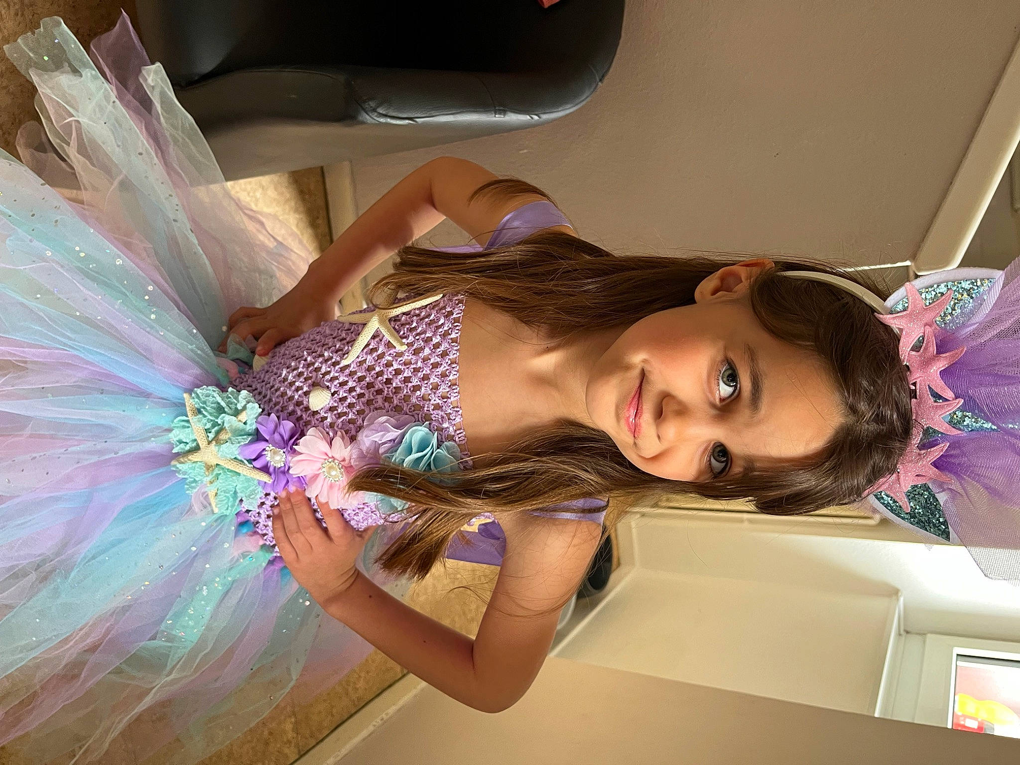 Mia participe au concours pour gagner de l'argent avec cette photo : arm, bridal_accessory, child, cool, dress, eyelash, facial_expression, fashion_design, finger, flash_photography, fun, happy, long_hair, person, pink, shoulder, skin, smile, textile, thigh