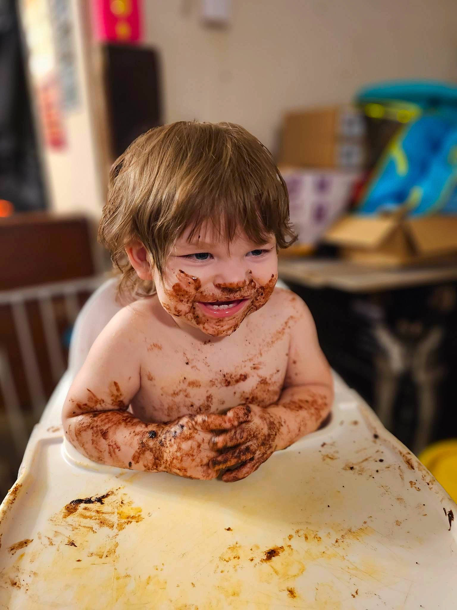 Auston is registered to the contest to win money with this photo: baby_playing_with_food, chair, child, comfort_food, cuisine, dish, eating, event, food, food_craving, fun, happy, party, person, plate, smile, sweetness, table, tableware, toddler