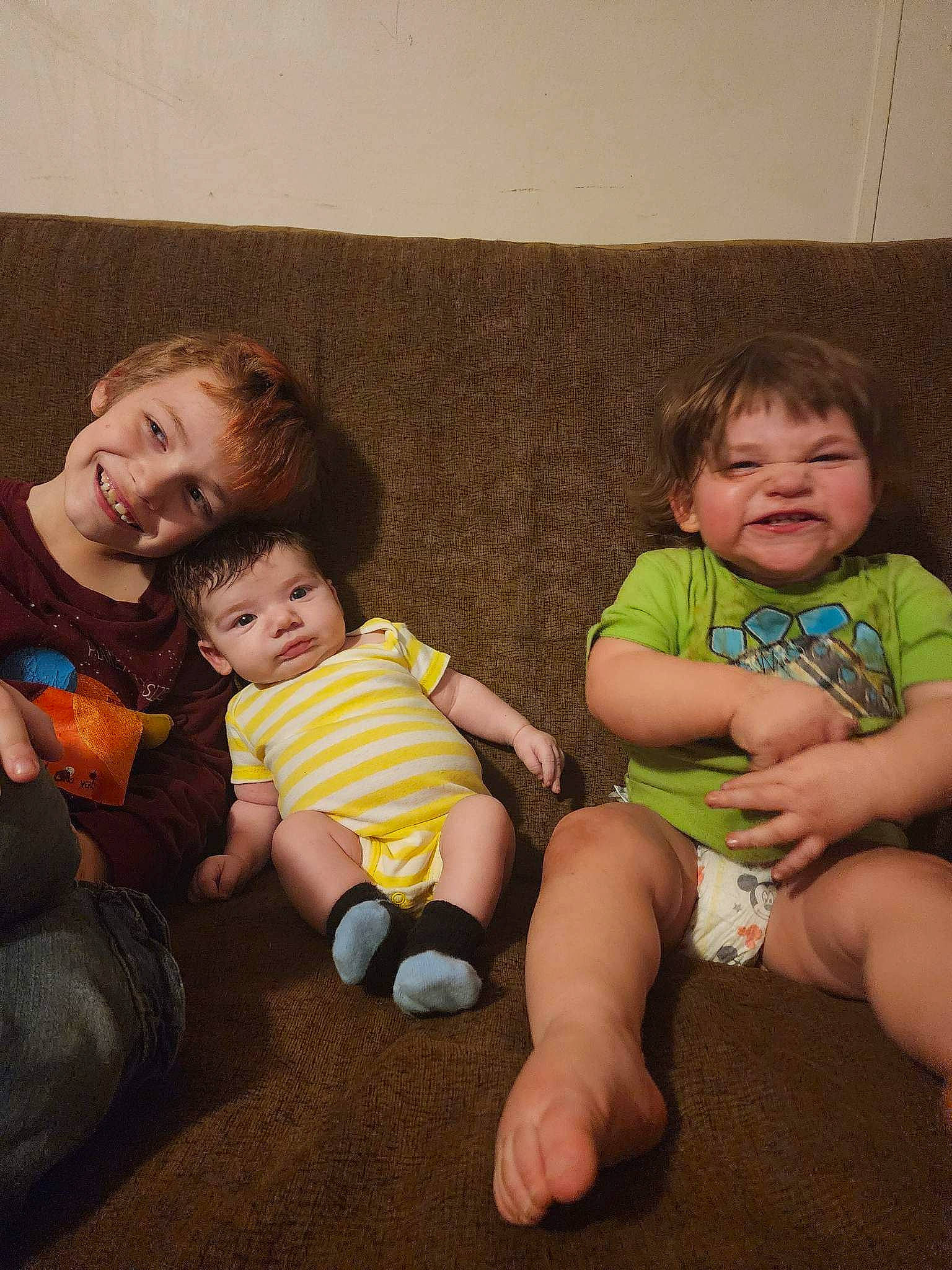 Charlie is registered to the contest to win money with this photo: baby, baby_toddler_clothing, cheek, clothing, comfort, couch, eye, face, finger, hand, happy, head, human_body, iris, joy, lap, leg, person, skin, smile