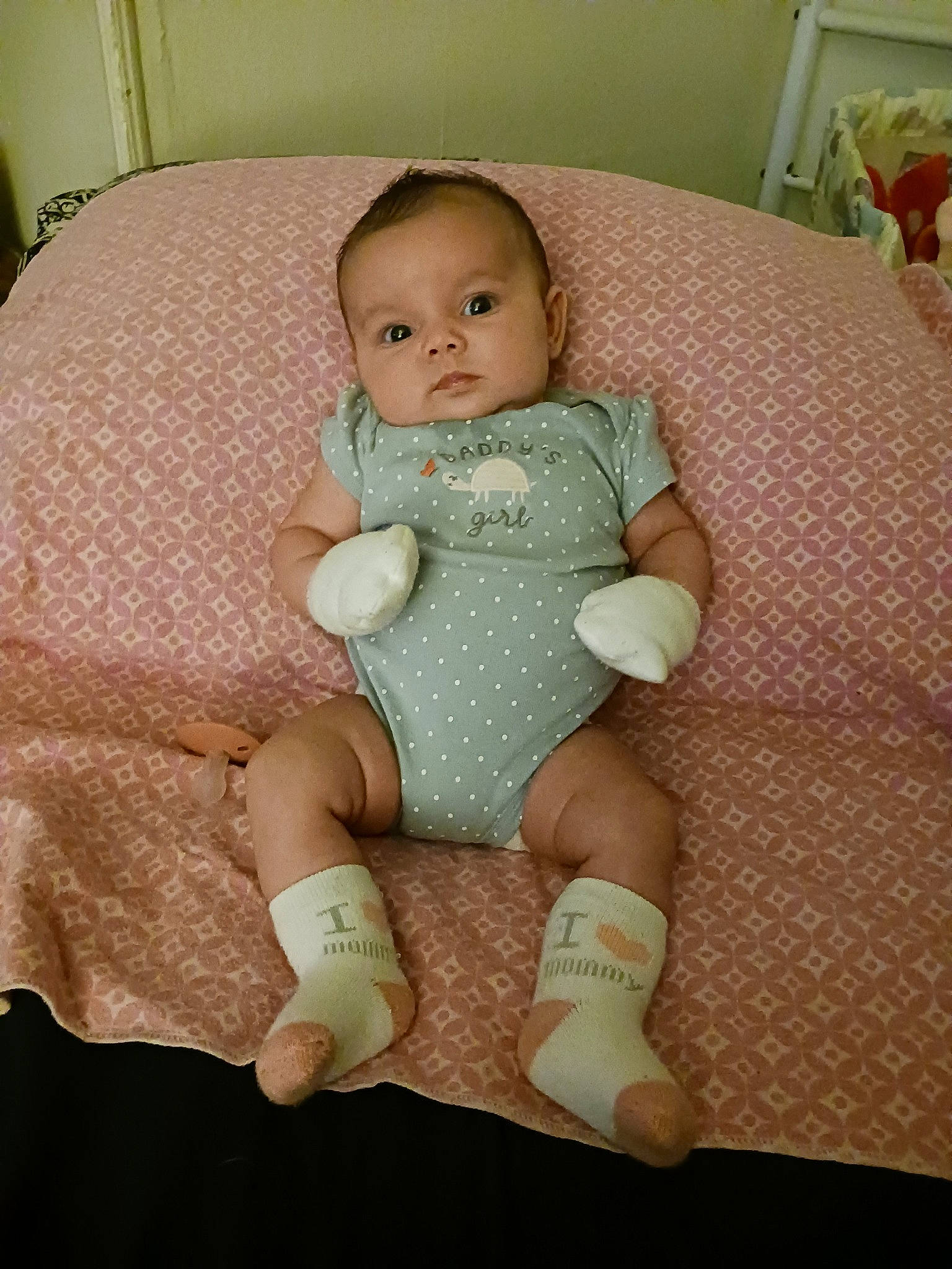 Aurora is registered to the contest to win money with this photo: arm, baby, baby_toddler_clothing, cheek, comfort, eye, finger, hand, head, human_body, iris, joint, knee, lap, leg, person, shoulder, skin, sleeve, sock