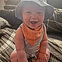 Mason joined the competition — help win amazing prizes! baby, smiling, hat, bib, indoor, child, sitting, bedspread, pattern, curtains, sunlight, happy, cheeks, clothing, infant, portrait, cute, home, fun, young