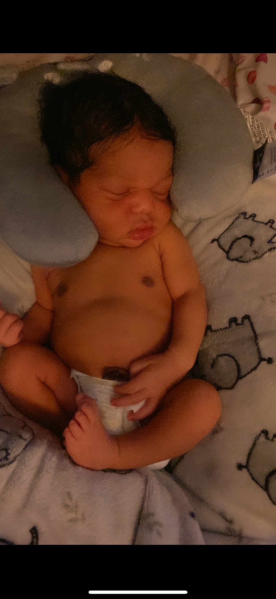 Jordyn Evans is registered to the contest to win money with this photo: baby, newborn, sleeping, diaper, neck_pillow, blanket, infant, cute, peaceful, soft, rest, child, cozy, comfort, skin, hand, foot, face, indoors, lying_down