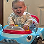 Saylor joined the competition — help win amazing prizes! baby, walker, toy, blue, pajamas, smiling, indoor, door, floor, child, playtime, happy, infant, cute, furniture, expression, clothing, person, home, joy