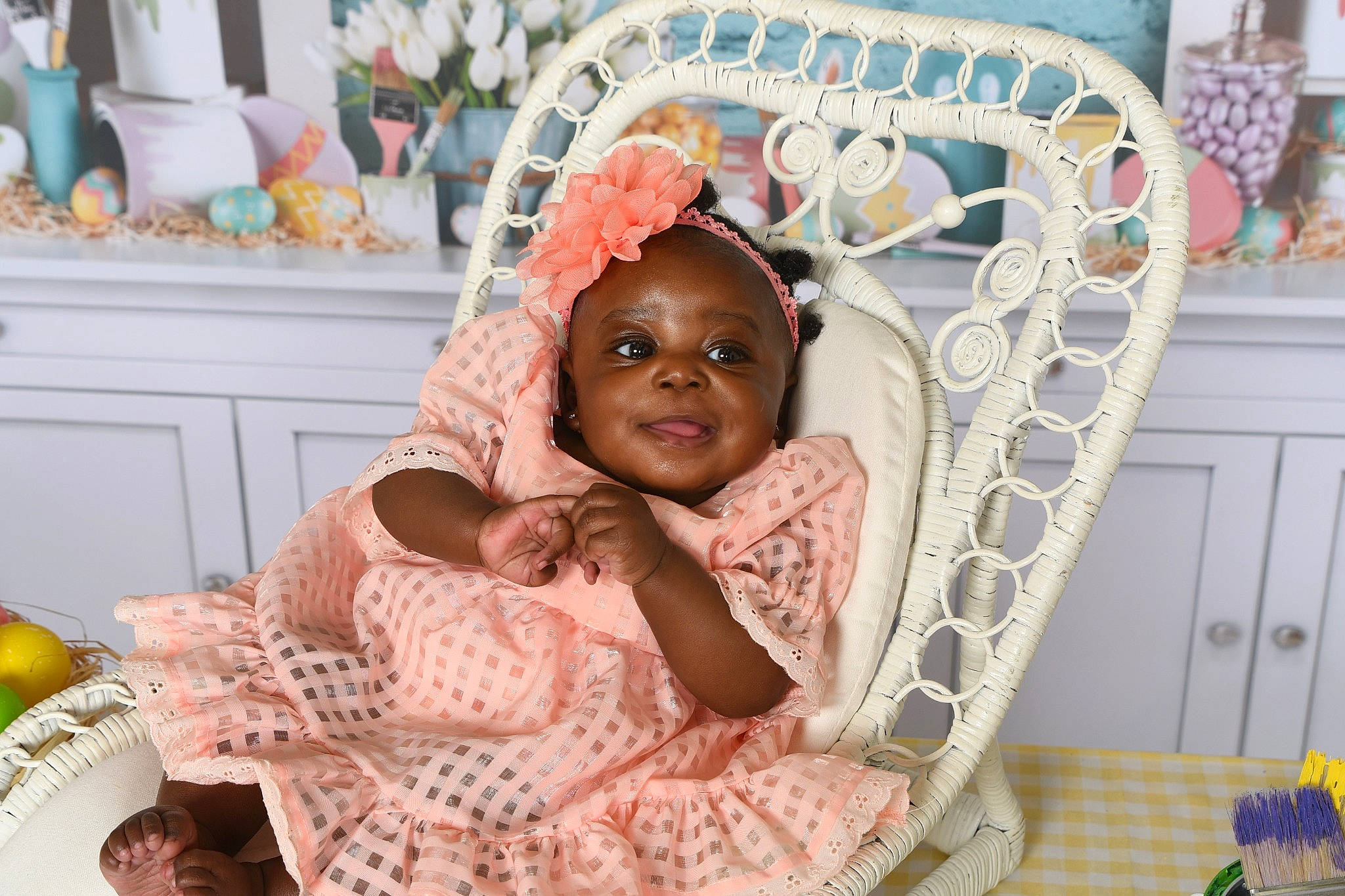 Ariana is registered to the contest to win money with this photo: baby, baby_toddler_clothing, chair, child, comfort, event, fun, happy, headpiece, linens, magenta, mouth, neck, pattern, person, pink, room, skin, textile, toddler