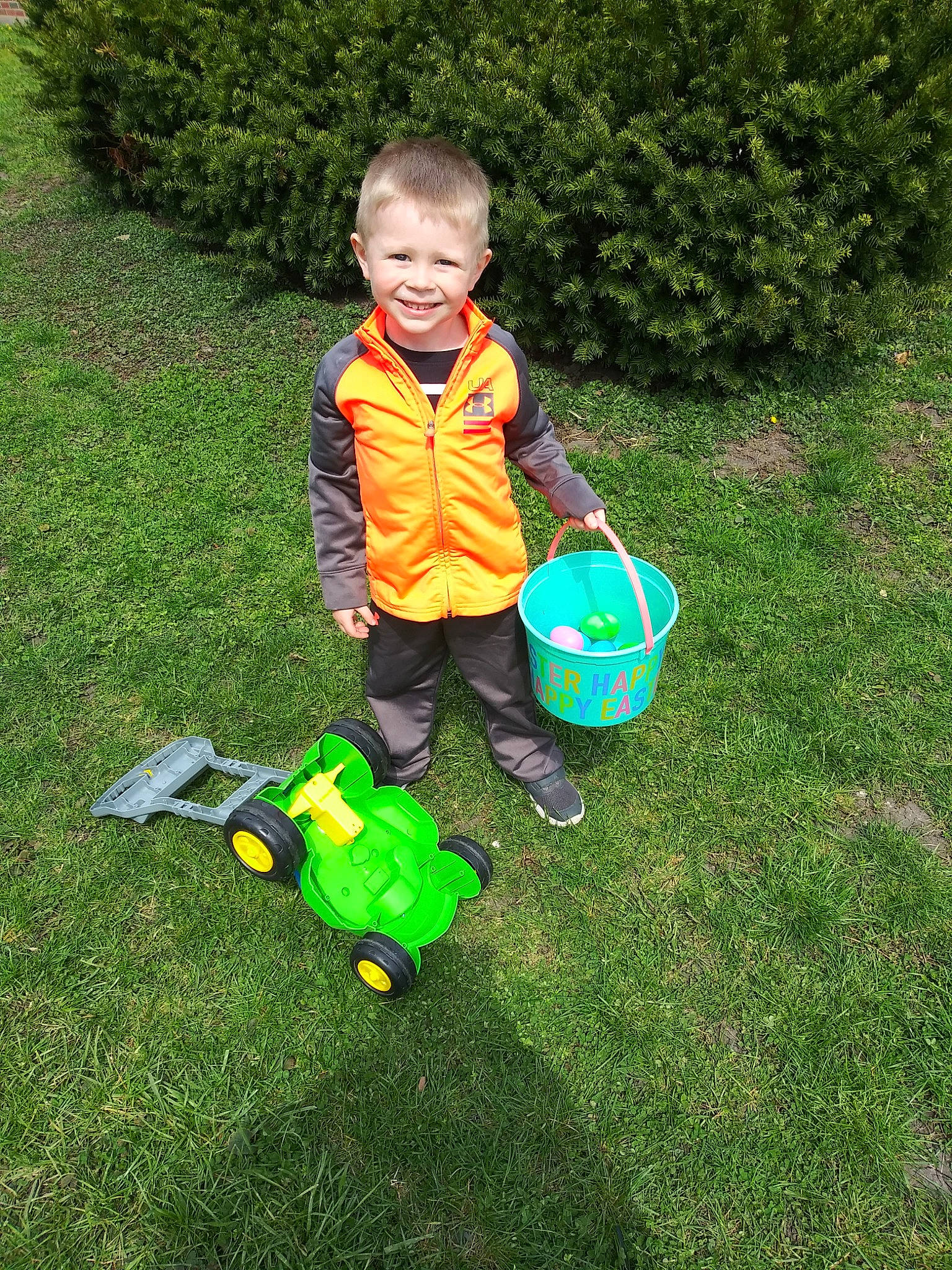 Caleb is registered to the contest to win money with this photo: bucket, child, fun, grass, joy, lawn, person, plant, play, toddler, vacation