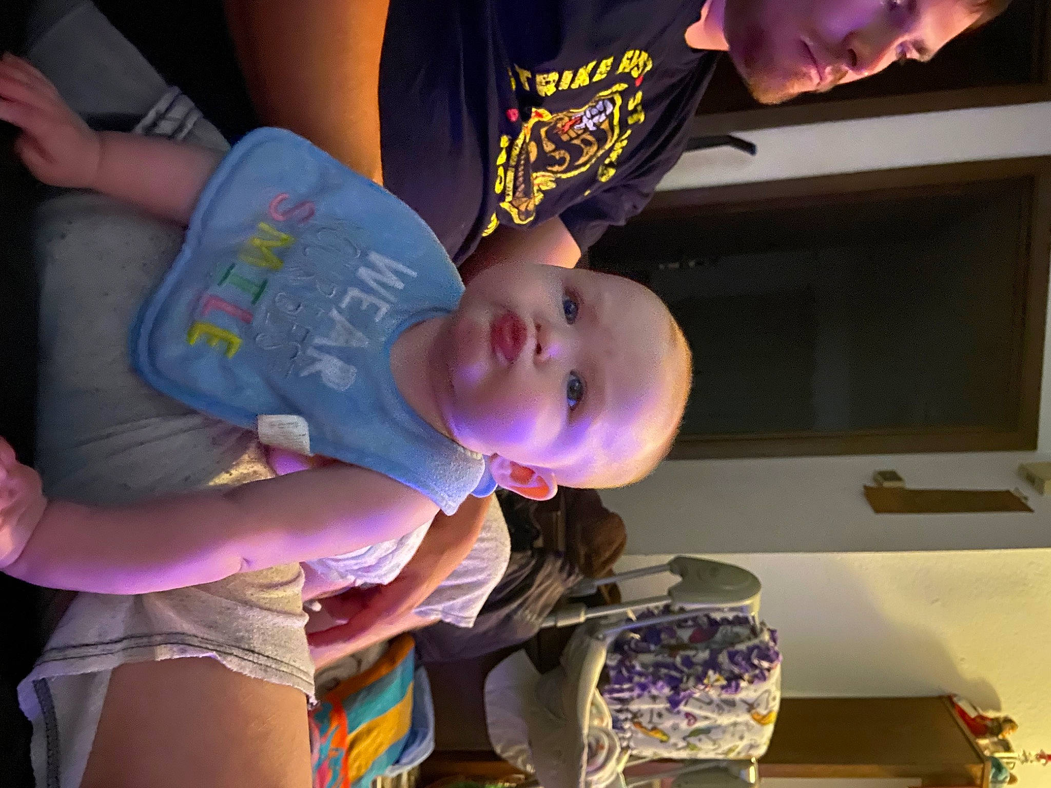 Gracelynn is registered to the contest to win money with this photo: baby, baby_products, baby_toddler_clothing, child, event, fun, happy, hat, human_body, magenta, mouth, nail, person, play, purple, room, smile, t_shirt, toddler, vacation