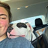 Apollo joined the competition — help win amazing prizes! person, dog, car_interior, seat, window, daylight, smile, shoulder, resting, black_and_white_dog, seatbelt, casual_clothing, happy, companion, road_trip, backseat, pet, relaxed, human_face, animal_face