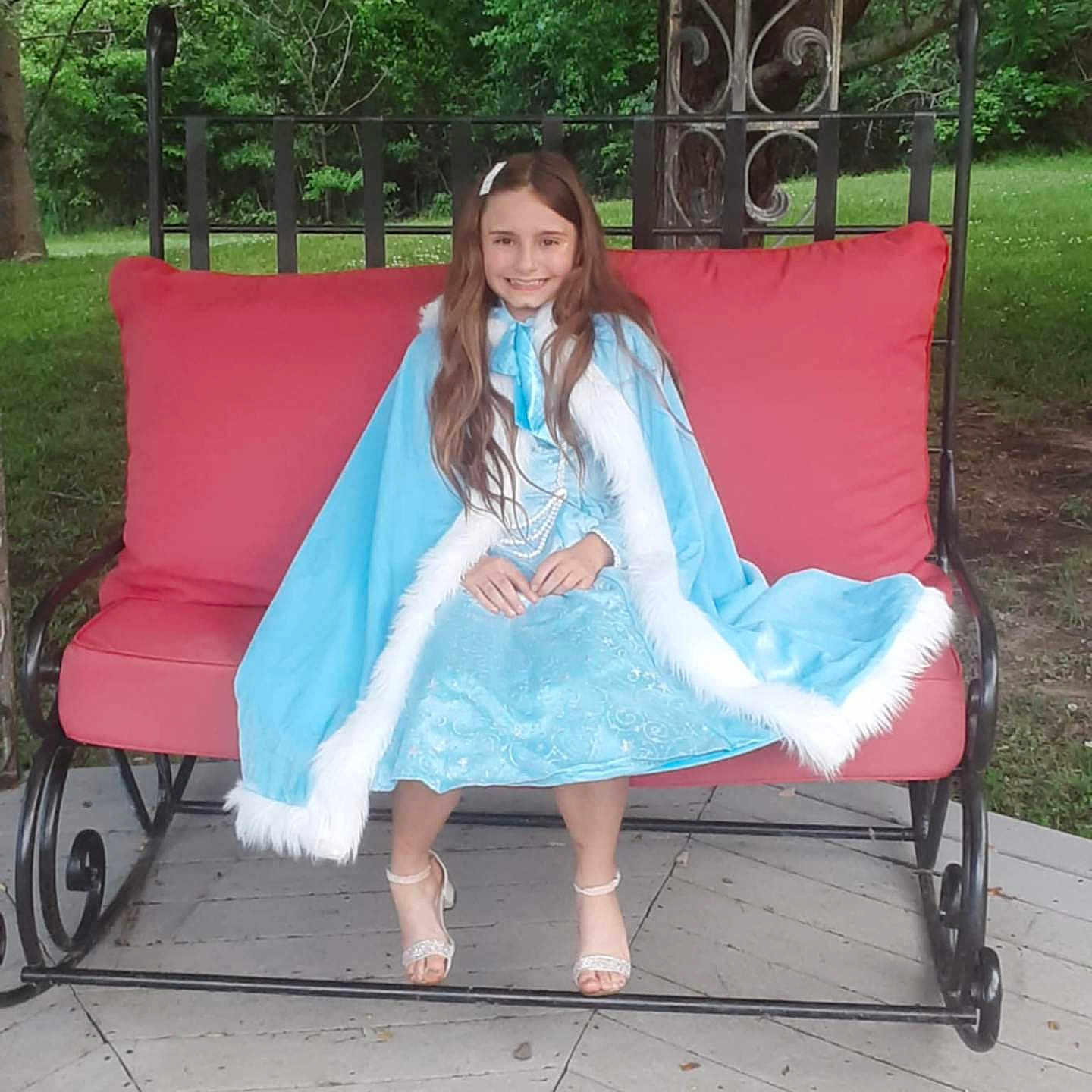 Blakely is registered to the contest to win money with this photo: chaise, child, clothing, coat, female, furniture, girl, person, sitting