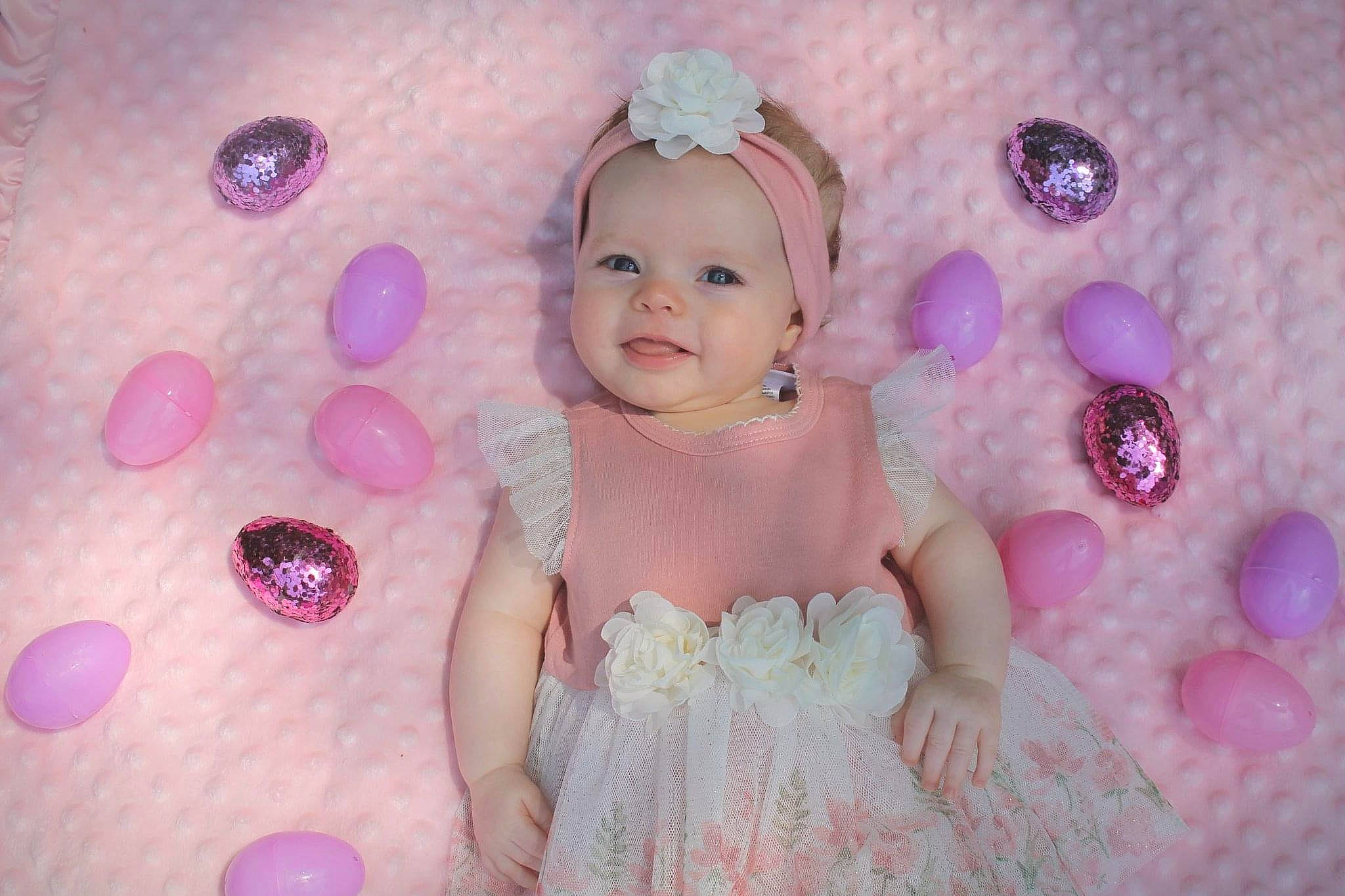 Lilia is registered to the contest to win money with this photo: baby, child, eye, fun, hair_accessory, headwear, iris, lavender, lilac, person, photography, pink, purple, skin, smile, toddler