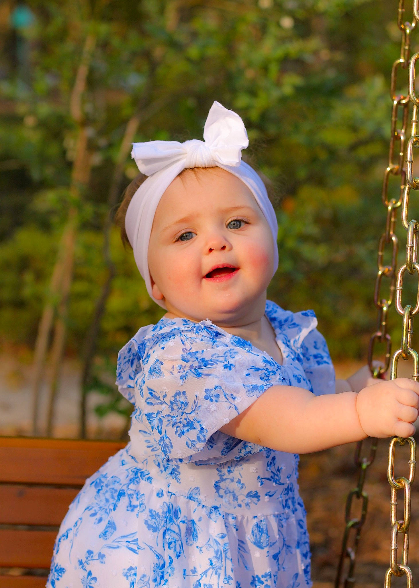 Adelina joined the competition — help win amazing prizes! baby, baby_toddler_clothing, child, electric_blue, eye, face, fashion_accessory, fun, grass, happy, head, headwear, leisure, pattern, people_in_nature, person, portrait_photography, sleeve, smile, swing