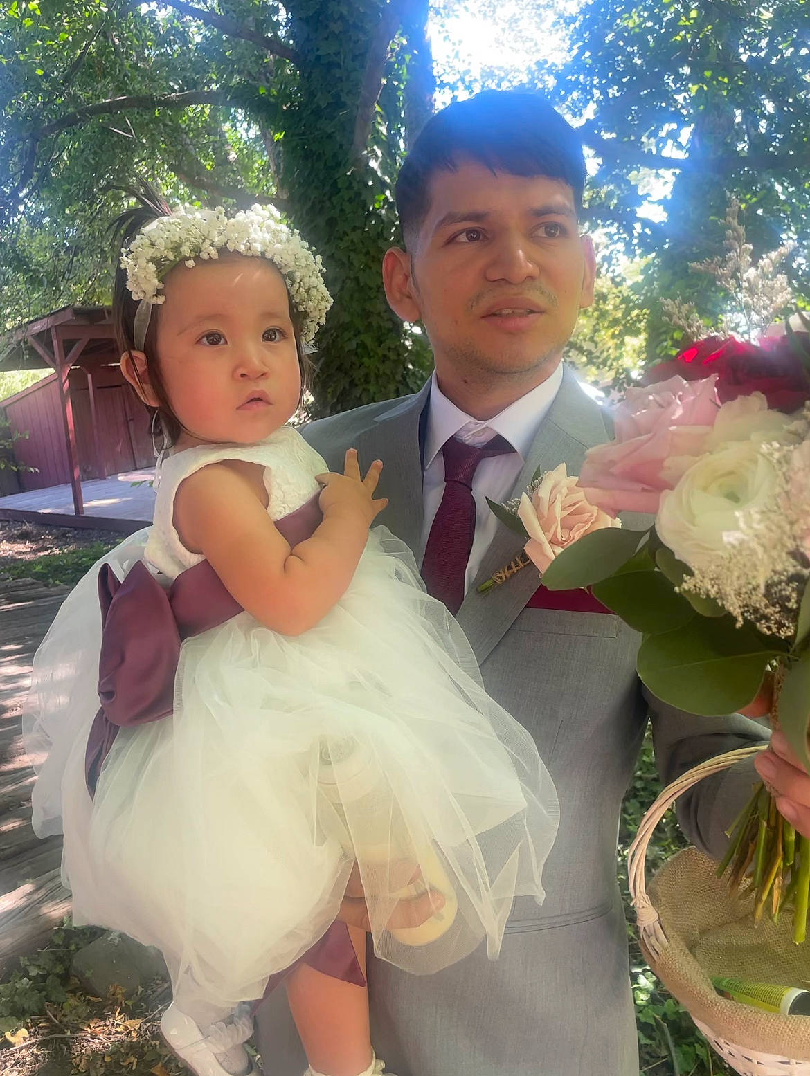 Kiara is registered to the contest to win money with this photo: bridal_accessory, bridal_clothing, bridal_party_dress, child, dress, event, facial_expression, formal_wear, fun, gown, grass, hairstyle, happy, headwear, person, pink, plant, tie, toddler, tree