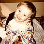 Piper is registered to the contest to win money with this photo: child, toddler, smiling, pajamas, halloween, pumpkin, orange, sparkly, indoor, blanket, happy, cute, face, person, cabinet, wood, sitting, holiday, costume, decor