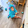 Enzo joined the competition — help win amazing prizes! toddler, child, costume, monster_costume, blue, purple, indoors, floor, wood_floor, stick, toy, basket, chair, furniture, looking_up, cute, home, curious, sitting, play