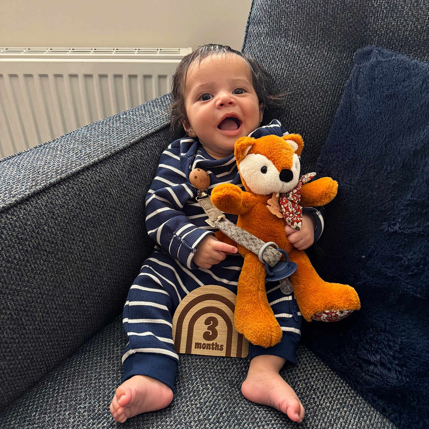 Ezra is registered to the contest to win money with this photo: architecture, baby, bodypart, chair, clothing, couch, cushion, face, finger, furniture, hand, head, homedecor, pants, person, photography, portrait, sitting, teddybear, toy