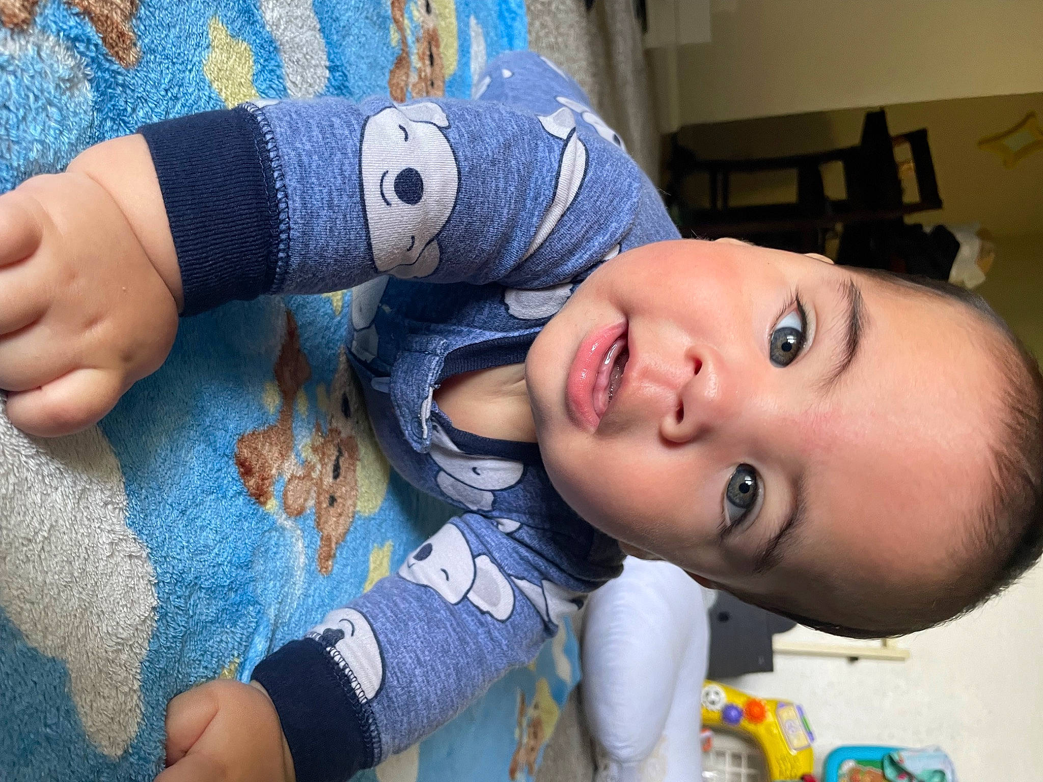Kaiden is registered to the contest to win money with this photo: arm, baby, baby_toddler_clothing, blue, cap, child, cool, electric_blue, eyelash, fashion_accessory, happy, human_body, iris, pattern, person, skin, smile, t_shirt, textile, toddler