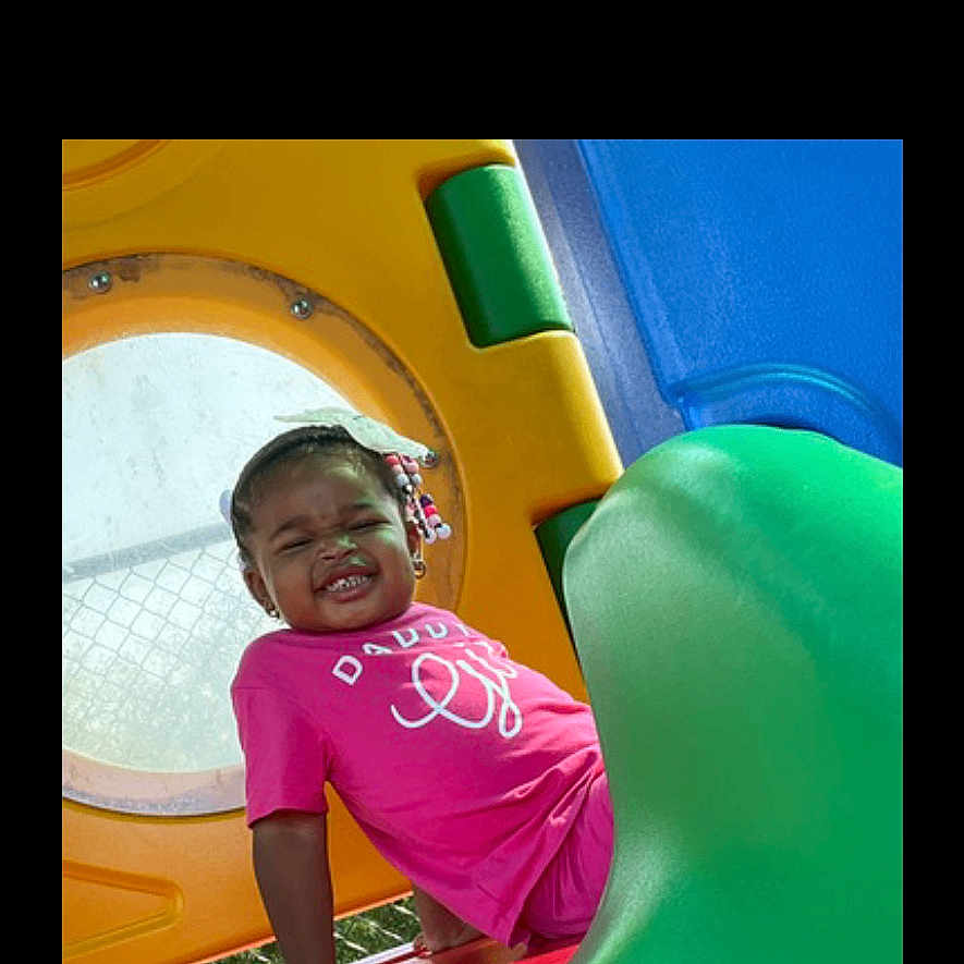 Ailah is registered to the contest to win money with this photo: amusementpark, child, clothing, face, female, girl, head, indoorplayarea, indoors, inflatable, outdoorplayarea, outdoors, person, photography, playarea, portrait, slide, t_shirt, toy, water