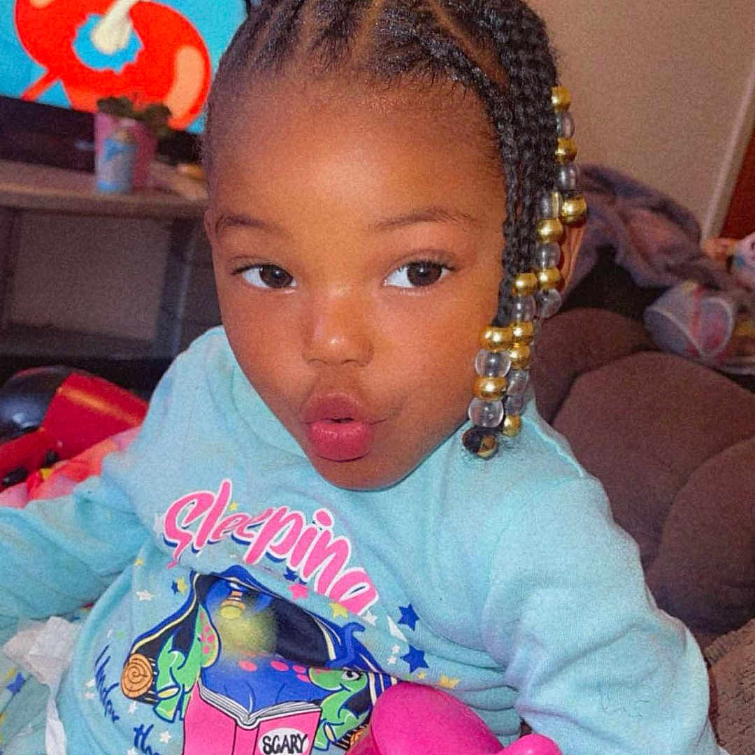 Brooklynn is registered to the contest to win money with this photo: baby, ball, computerhardware, couch, electronics, face, football, furniture, hair, hardware, head, indoors, monitor, person, photography, portrait, screen, soccer, soccerball, tv