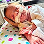 newborn, baby, infant, medical_tube, hospital, blanket, hand, polka_dot, resting, sleeping, cute, skin, clothing, bed, care, child, small, indoors, comfort, patient